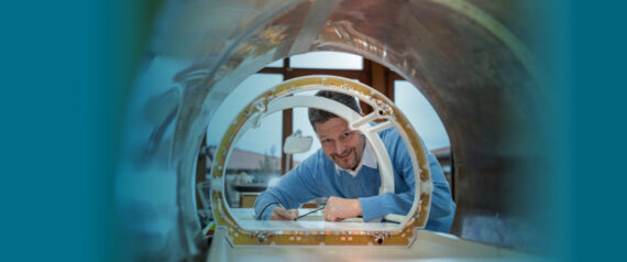 RAPID Biomedical engineer looking through a coil